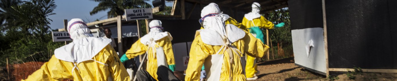 Doctors carry a patient infected by ebola