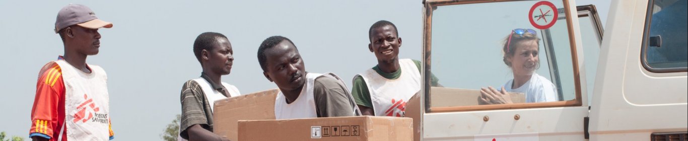 MSF logistician Jennifer Bock and her colleagues unload 58 boxes one ton of medical supplies, mainly malaria testing kits, destined for the MSF-supported health centre in Boguila.