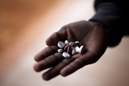 a dozen of pills in a hand