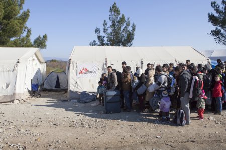 Refugees from Iraq, Afghanistan and Syria wait to cross the border from Greece to Macedonia at Idomeni